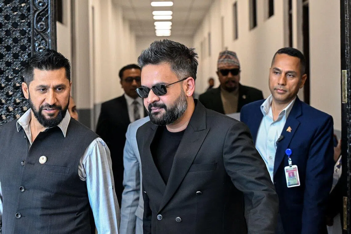 Nepal's Prime Minister Balendra Shah (centre) and Rastriya Swatantra Party president Rabi Lamichhane (left) arrive to attend the April 2 Parliament session in Kathmandu.