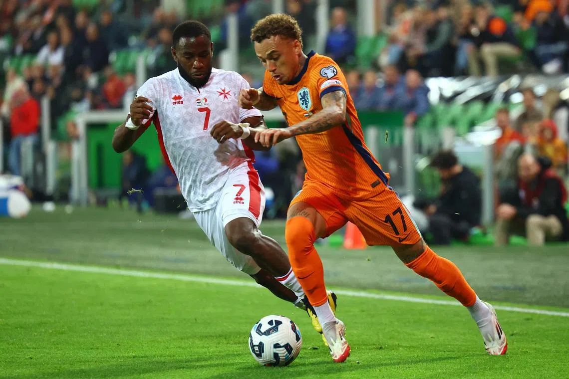 FILE PHOTO: Soccer Football - World Cup - European Qualifiers - Group G - Netherlands v Malta - Euroborg Stadion, Groningen, Netherlands - June 10, 2025 Netherlands' Noa Lang in action with Malta's Joseph Mbong REUTERS/Piroschka Van De Wouw