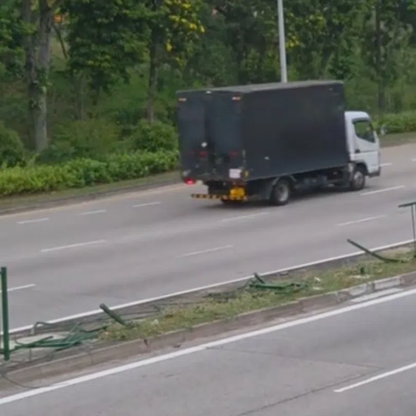 A section of the central divider was broken through, with metal railings splayed across the road.