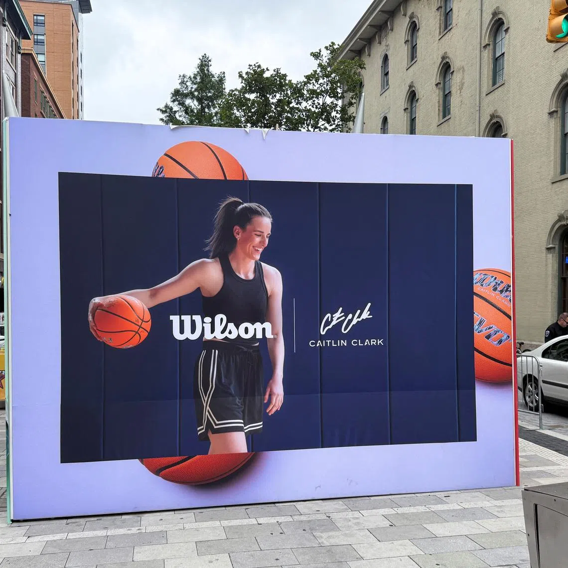 An advertisement featuring Caitlin Clark is displayed ahead of the WNBA All-Star Game, in Indianapolis, Indiana, July 19, 2025. REUTERS/Amy Tennery