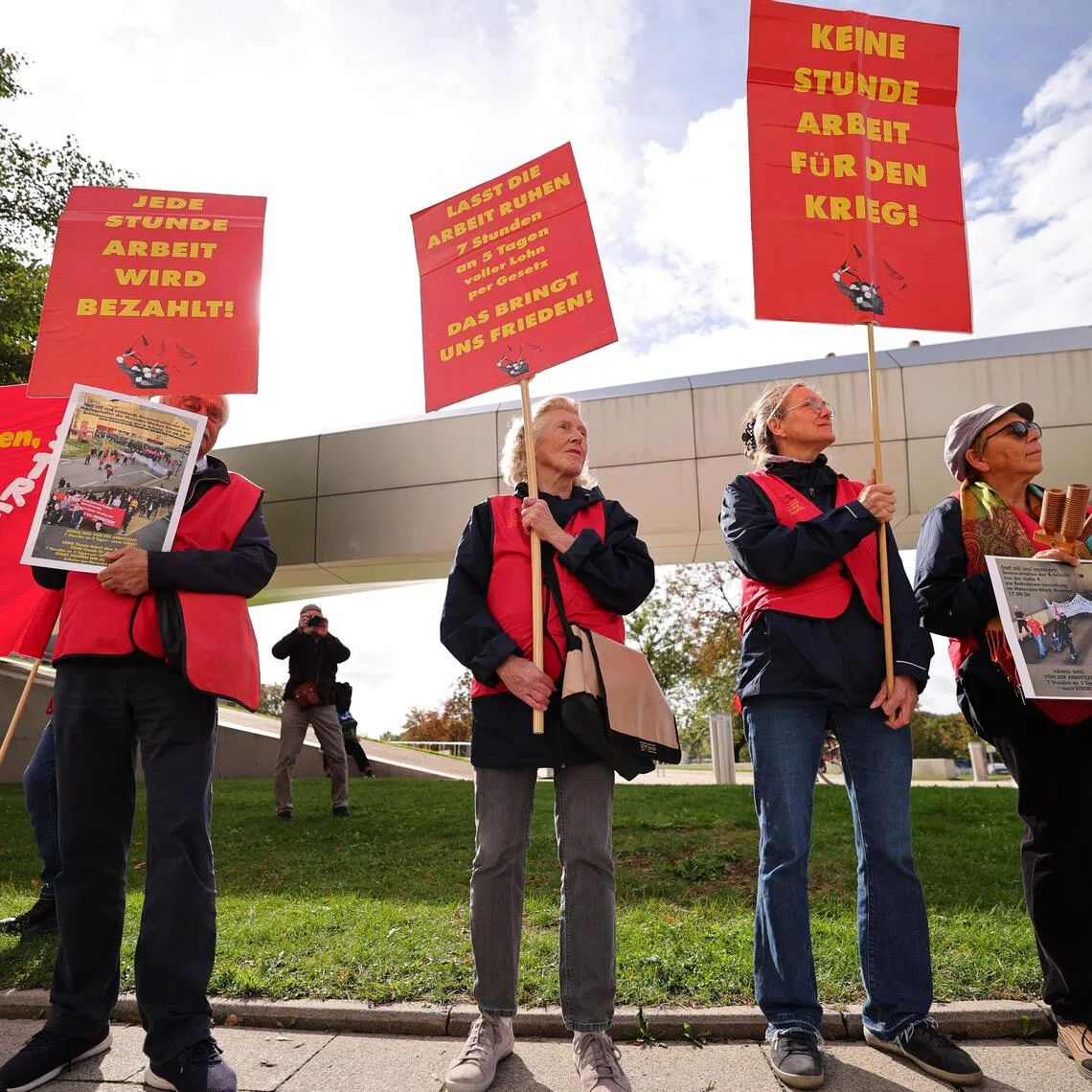 BMW workers participating in a protest rally as part of the IG Metall Day of Action in Munich on Sept 21.