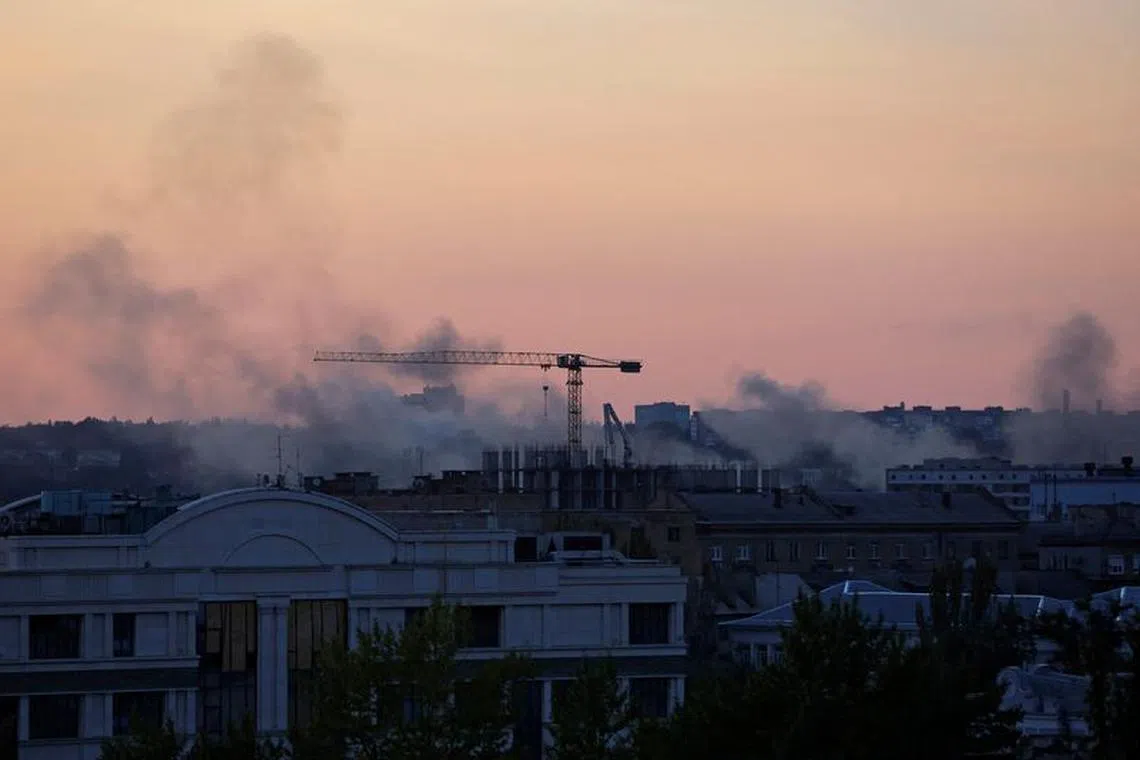 FILE PHOTO: Smoke rises above buildings following a shelling in the course of Russia-Ukraine conflict in Donetsk, Russian-controlled Ukraine, September 10, 2023. REUTERS/Alexander Ermochenko/File Photo