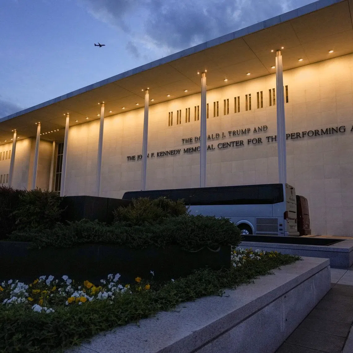 A plane flies by the John F. Kennedy Memorial Center for the Performing Arts, renamed The Donald J. Trump and The John F. Kennedy Memorial Center for the Performing Arts by the Trump administration, in Washington, D.C., U.S., April 23, 2026. REUTERS/Ken Cedeno