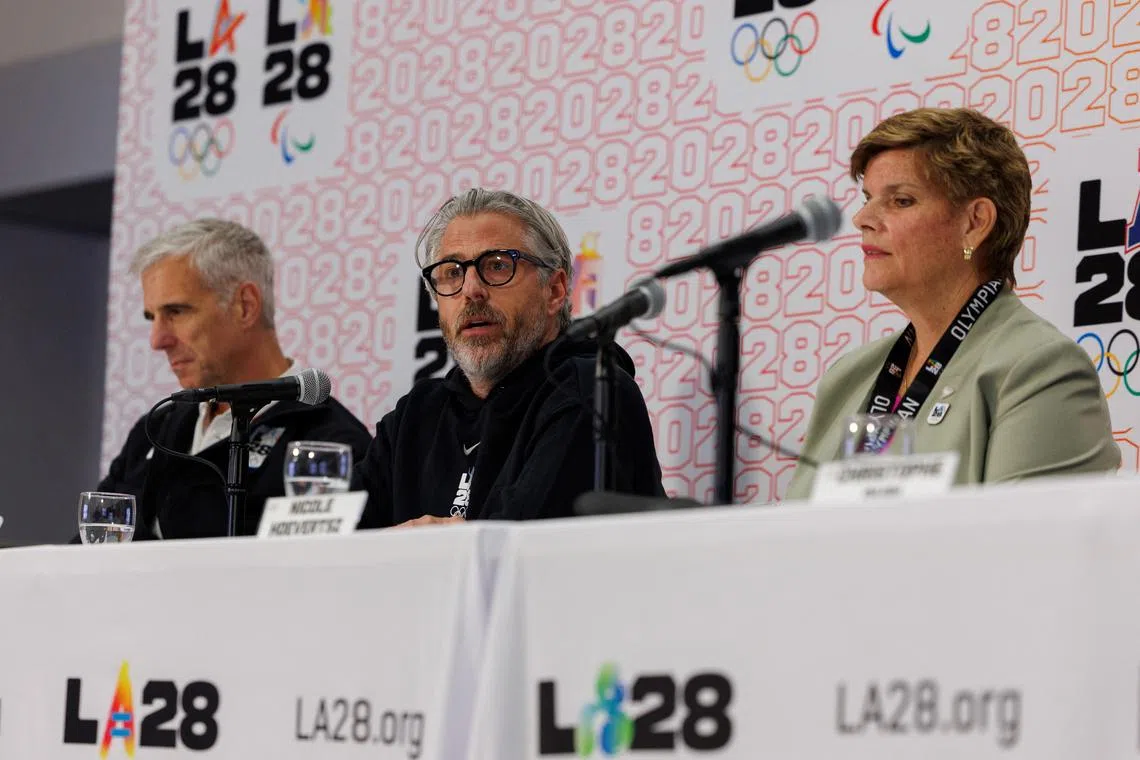Casey Wasserman, LA28 Chairperson and President speaks between Nicole Hoevertsz, IOC Vice President and LA28 Coordination Commission Chair, and Reynold Hoover, LA28 Chief Executive Officer, during a press conference in Los Angeles, California, U.S. June 5, 2025.  REUTERS/Mike Blake