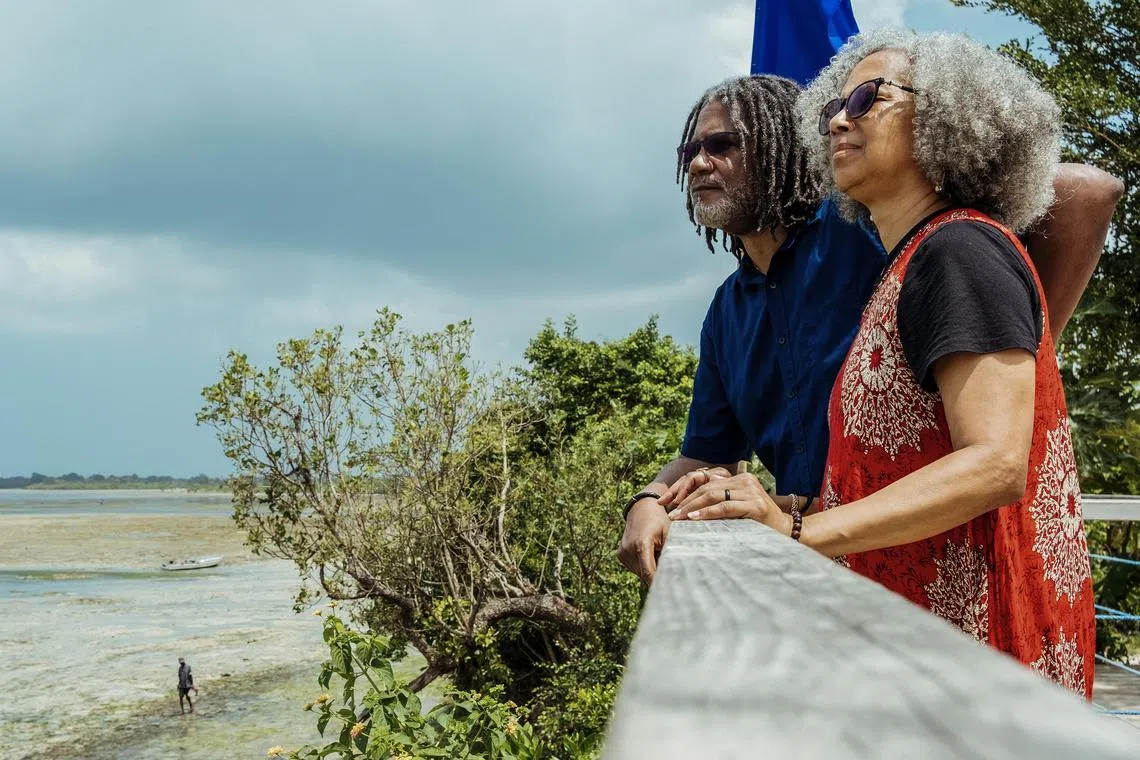 Mark and Marlene Bradley take in the view from their housing development in Zanzibar, Tanzania on Feb. 13, 2024. Since moving to Zanzibar in 2022, the couple have been embracing island life by taking it slow. (Khadija Farah/The New York Times)