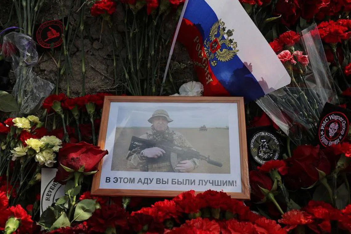 A view shows a portrait of Wagner mercenary chief Yevgeny Prigozhin at a makeshift memorial near former PMC Wagner Centre in Saint Petersburg, Russia August 25, 2023. REUTERS/Anton Vaganov/File Photo