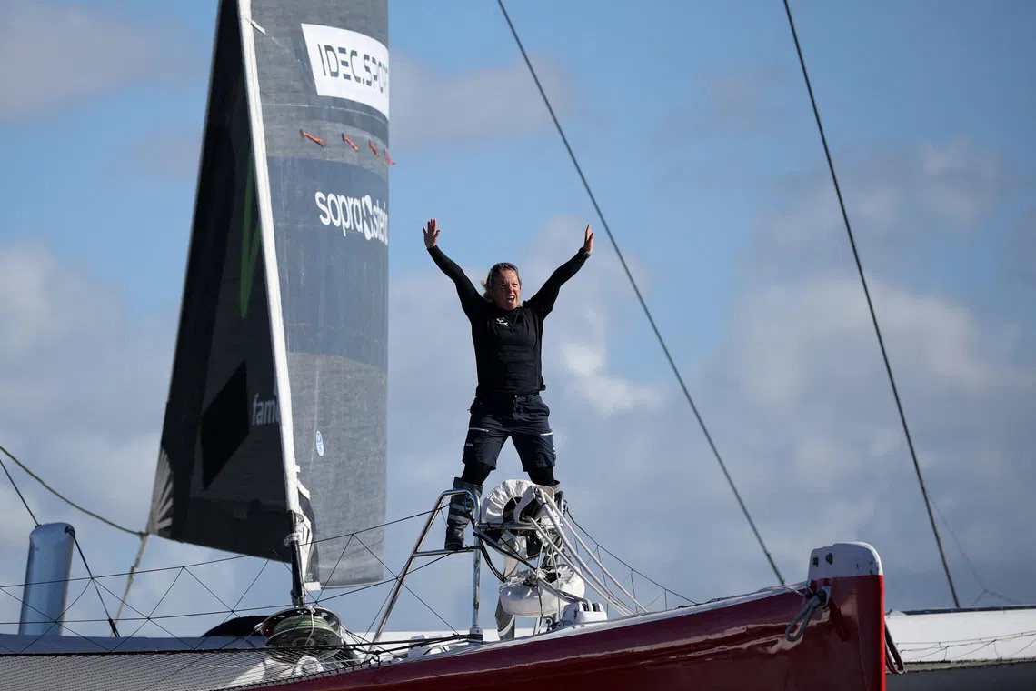 French skipper Alexia Barrier poses aboard her Ultim trimaran during a training sail off Brest, France, October 1, 2026, as she prepares to become the first woman to race an Ultim multihull, a 32-metre trimaran, in the Route du Rhum transatlantic race in November. REUTERS/Stephane Mahe