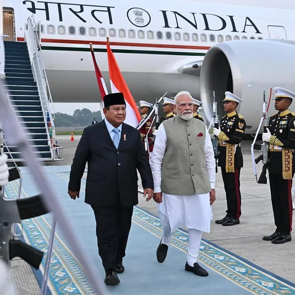 Indian Prime Minister Narendra Modi arrives in Jakarta and is greeted by Indonesian President Prabowo Subianto.