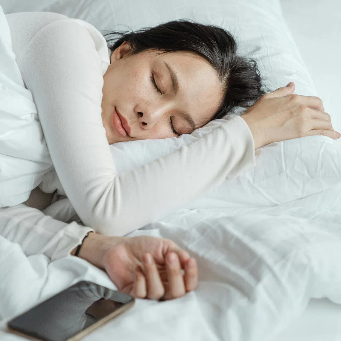 Although many people use their smartphones in bed, experts say it is best to limit one's exposure to electronics for at least 30 minutes before bedtime.  
