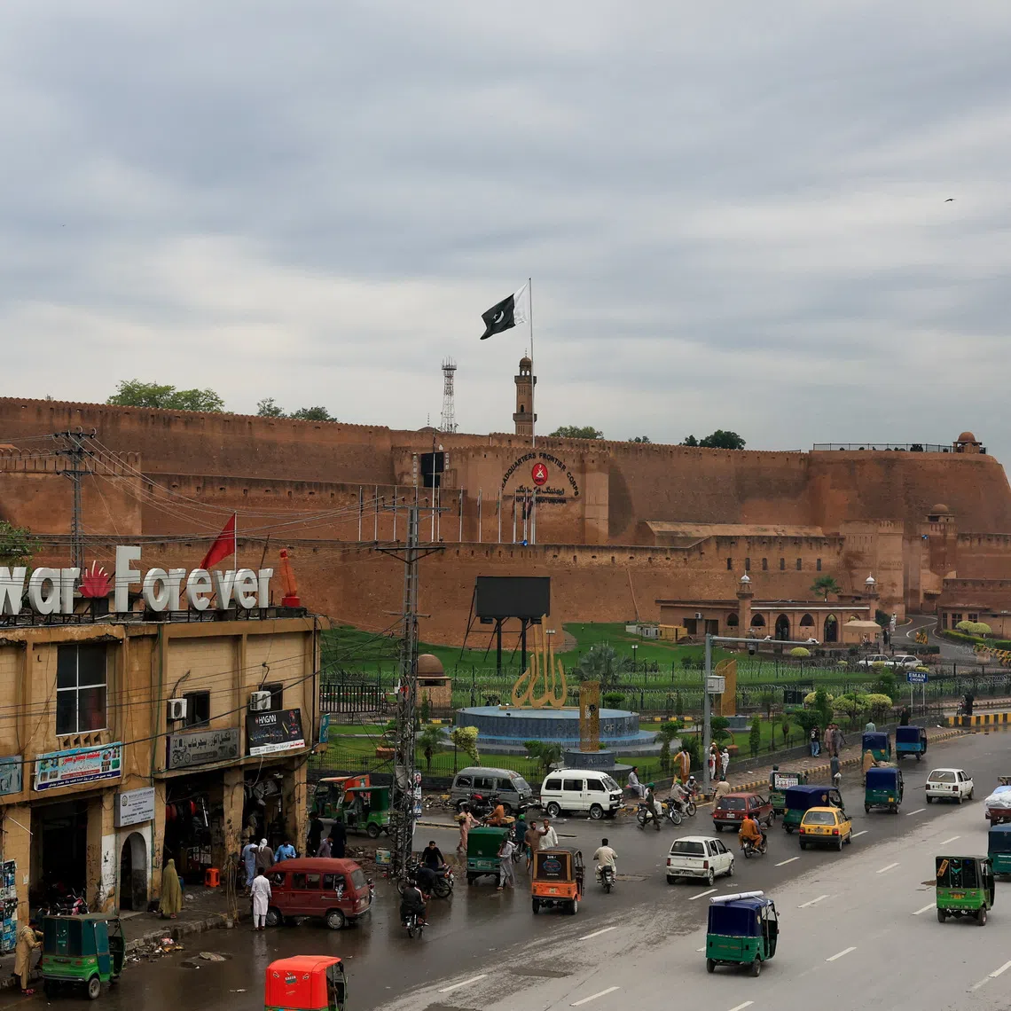 Traffic moves past Bala Hisar Fort, which serves as the headquarters of Pakistan's Frontier Corps, in the background, days after Pakistan imposed a state of emergency in Khyber Pakhtunkhwa province and suspended the provincial government led by the party of jailed former Prime Minister Imran Khan, in Peshawar, Pakistan, October 13, 2026. REUTERS