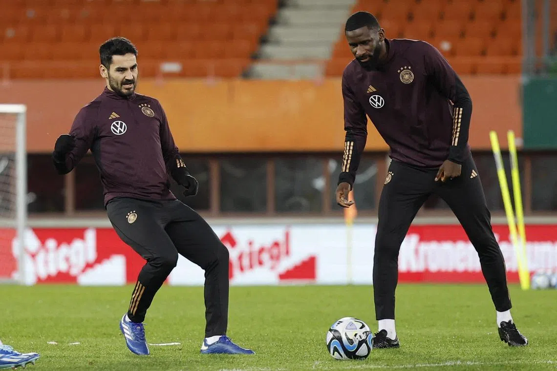 Germany's Antonio Rudiger (right) and Ilkay Gundogan during a training session. The Euro 2024 draw will take place in Hamburg on Dec 2.