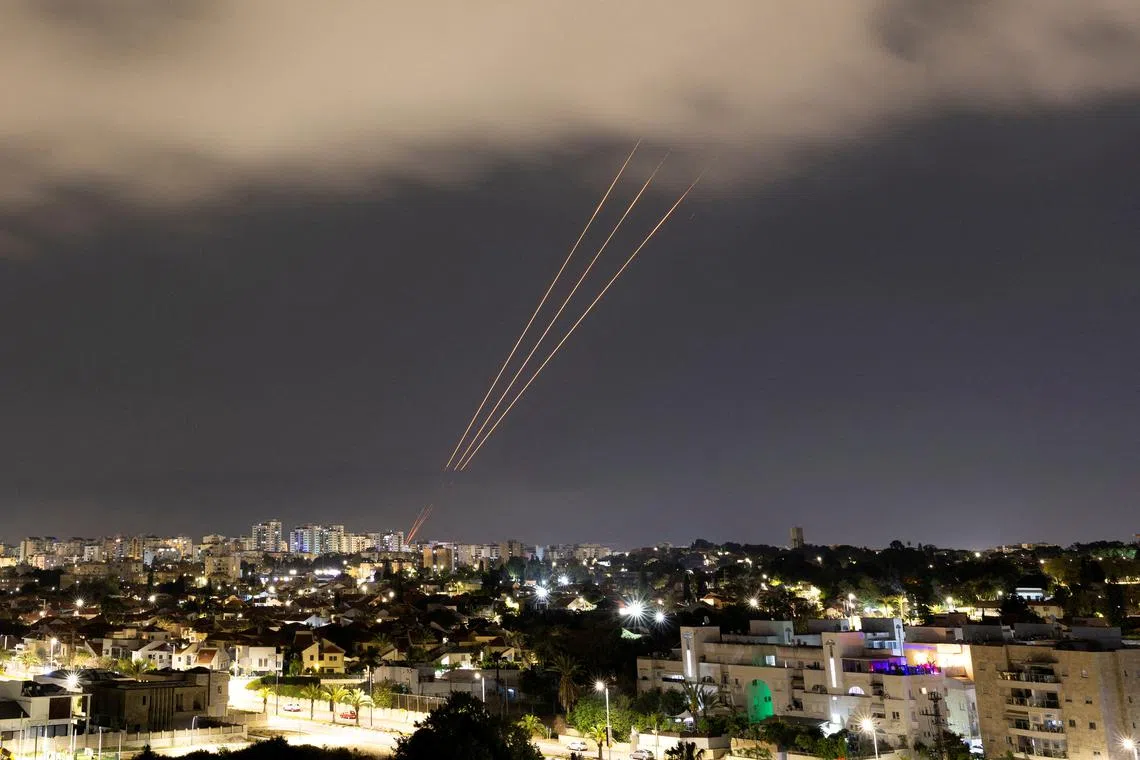FILE PHOTO: An anti-missile system operates after Iran launched drones and missiles towards Israel, as seen from Ashkelon, Israel April 14, 2024. REUTERS/Amir Cohen/File Photo