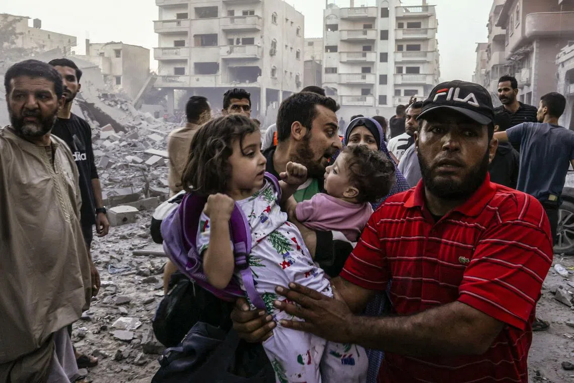People flee following an Israeli strike on Rafah, in the southern Gaza Strip.