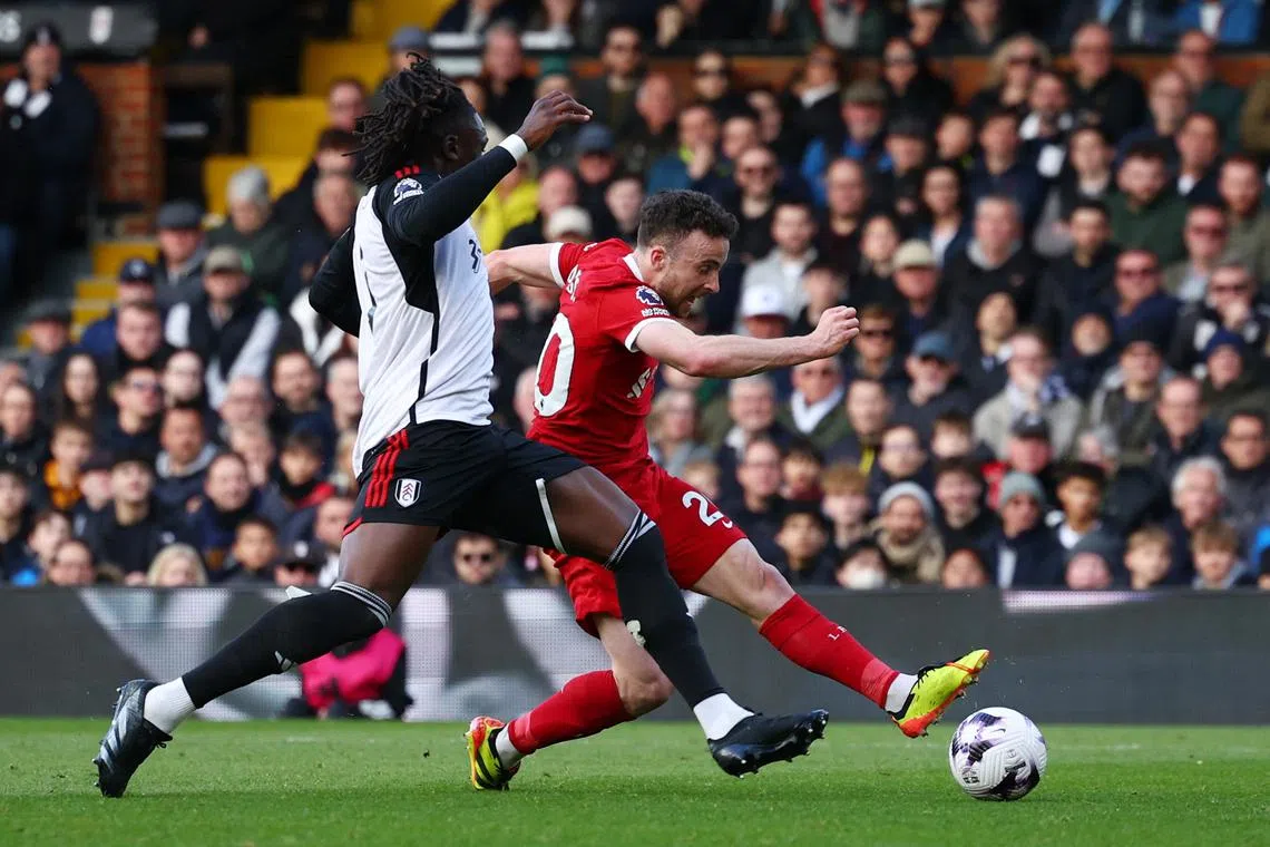 Soccer Football - Premier League - Fulham v Liverpool - Craven Cottage, London, Britain - April 21, 2024 Liverpool's Diogo Jota scores their third goal Action Images via Reuters/Andrew Boyers