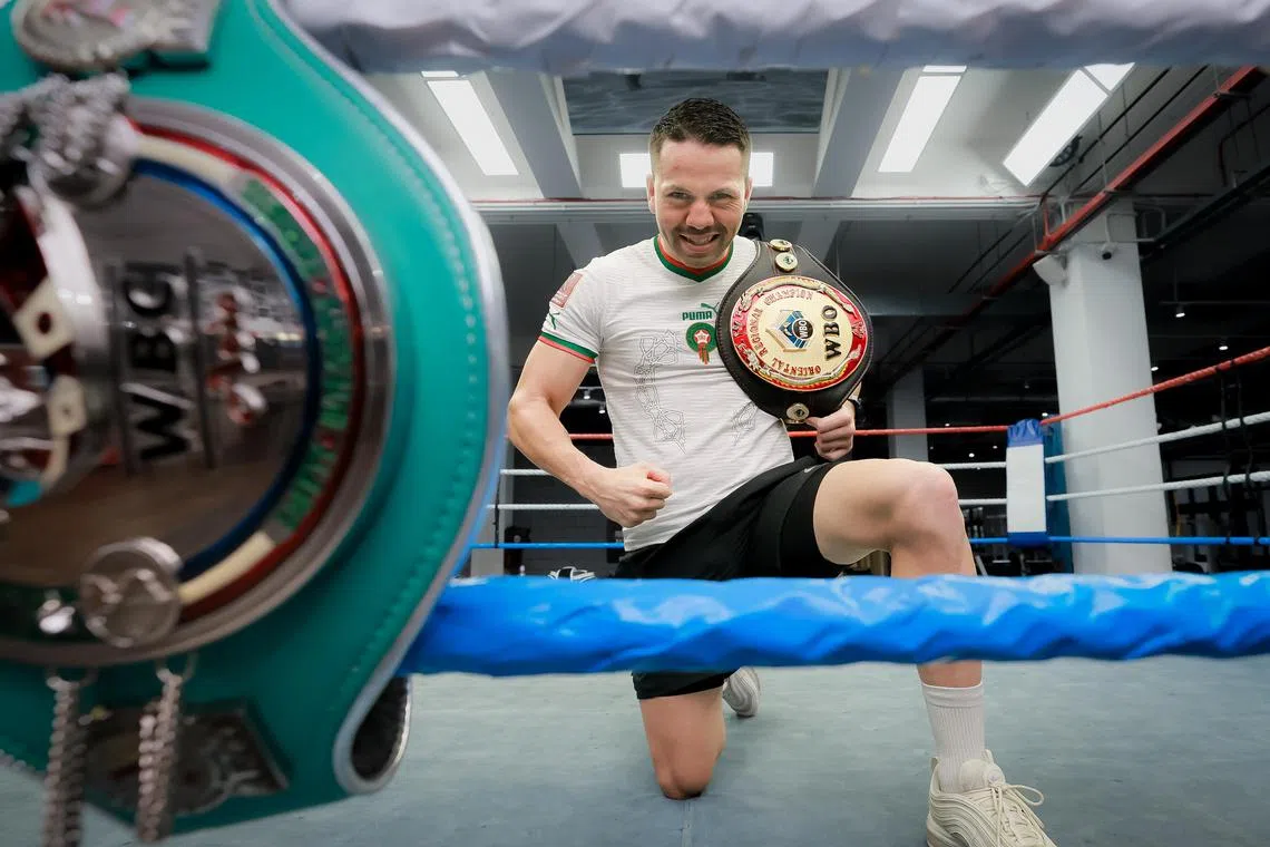 Moroccan boxer Abdelelah Karroum, pictured in his country's football jersey, will be rooting for them in their quarter-final match against Portugal on Saturday.