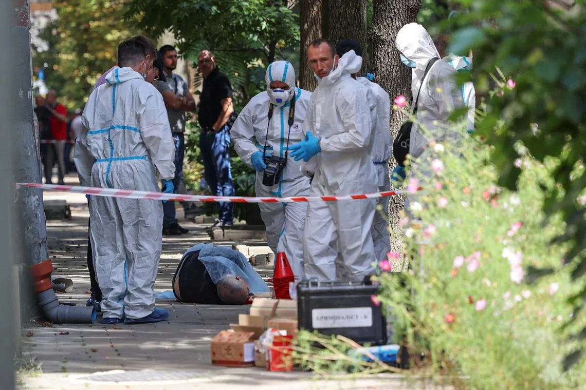 FILE PHOTO: SENSITIVE MATERIAL. THIS IMAGE MAY OFFEND OR DISTURB Investigators inspect the body of former Ukrainian parliamentary speaker Andriy Parubiy, who was killed this morning, amid Russia's attack on Ukraine, in Lviv, Ukraine August 30, 2025. REUTERS/Roman Baluk/File Photo