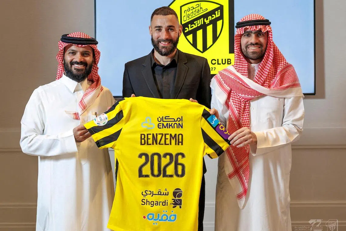 Benzema (centre) joins the Saudi Arabian champions on a three-year deal and will wear the number nine shirt.