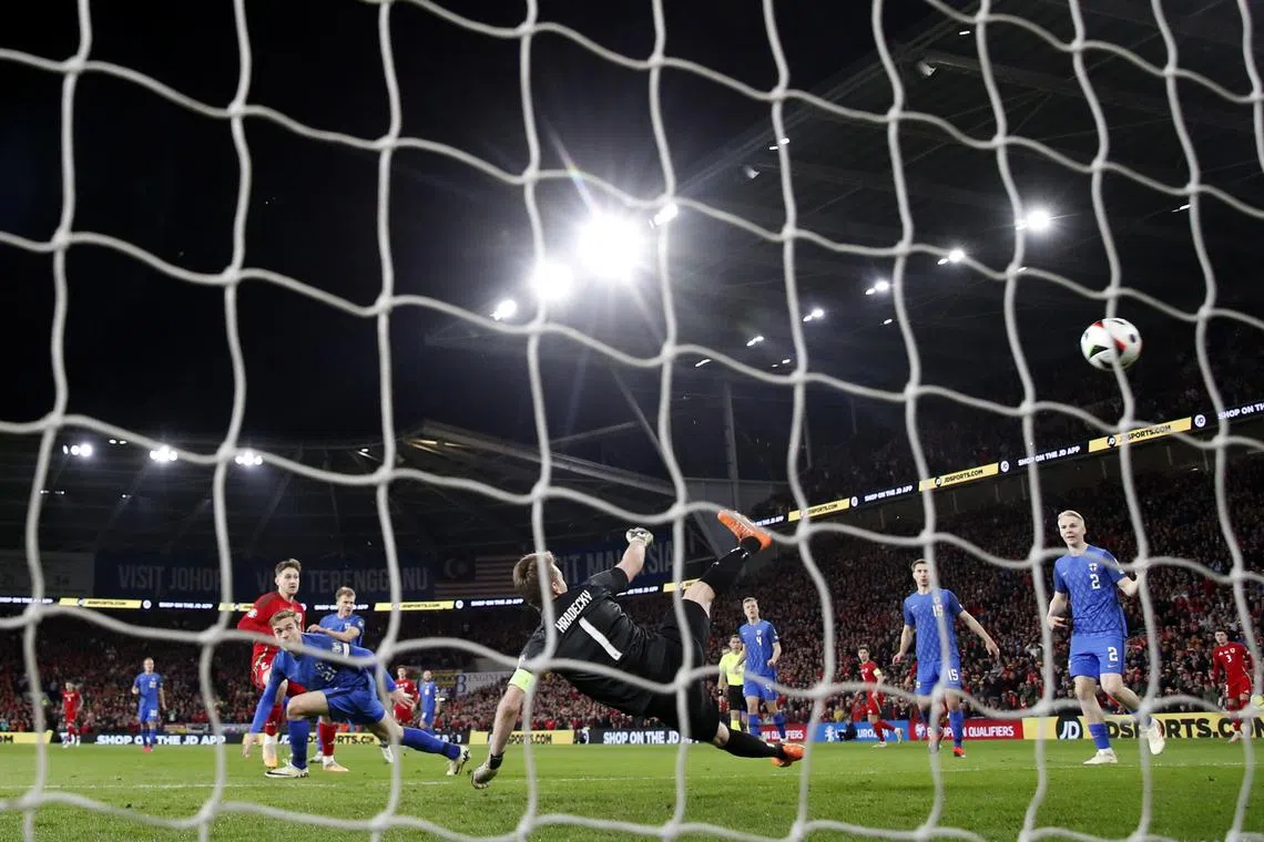 Soccer Football - Euro 2024 Qualifier - Play-Off - Wales v Finland - Cardiff City Stadium, Cardiff, Wales, Britain - March 21, 2024 Wales' David Brooks scores their first goal REUTERS/Paul Childs