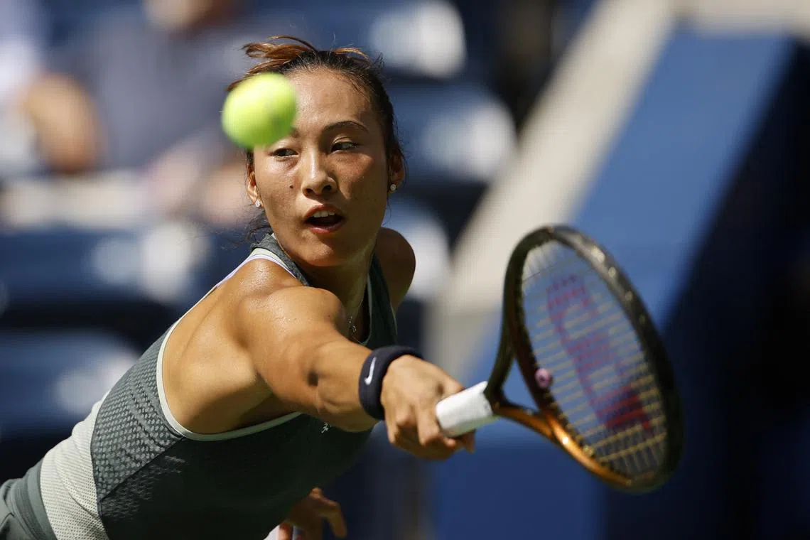 Tennis - U.S. Open - Flushing Meadows, New York, United States - August 26, 2024 China's Qinwen Zheng in action during her first round match against Amanda Anisimova of the U.S. REUTERS/Eduardo Munoz