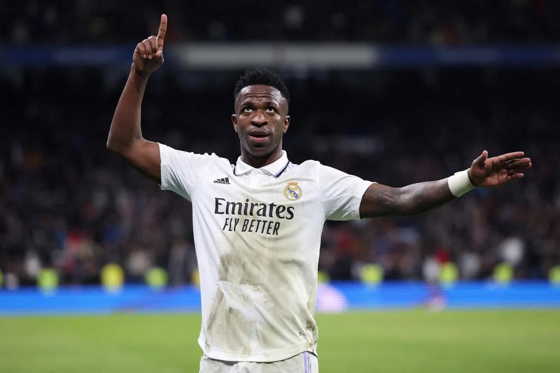 Real Madrid's Brazilian forward Vinicius Junior celebrates after scoring his team's third goal during the Copa del Rey (King's Cup), quarter final football match between Real Madrid CF and Club Atletico de Madrid at the Santiago Bernabeu stadium in Madrid on January 26, 2023. (Photo by Pierre-Philippe MARCOU / AFP)