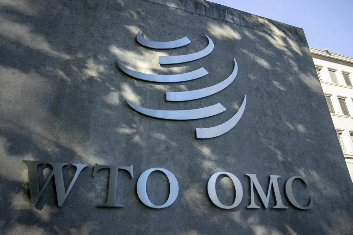 FILE PHOTO: A logo is seen at the World Trade Organization (WTO) headquarters before a news conference in Geneva, Switzerland, October 5, 2022. REUTERS/Denis Balibouse/File Photo
