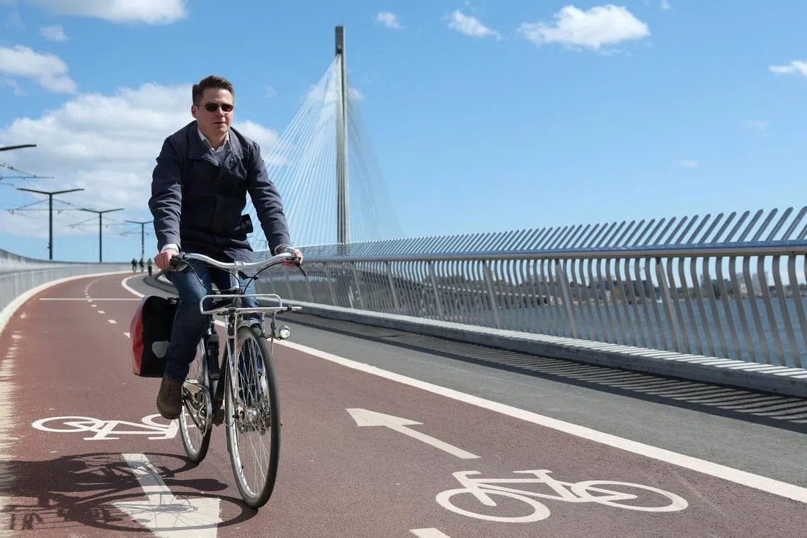 Team Leader of Bicycle Traffic, Oskari Kaupinmaki, rides his bike in Helsinki, Finland, May 5, 2026. REUTERS/Leonhard Foeger