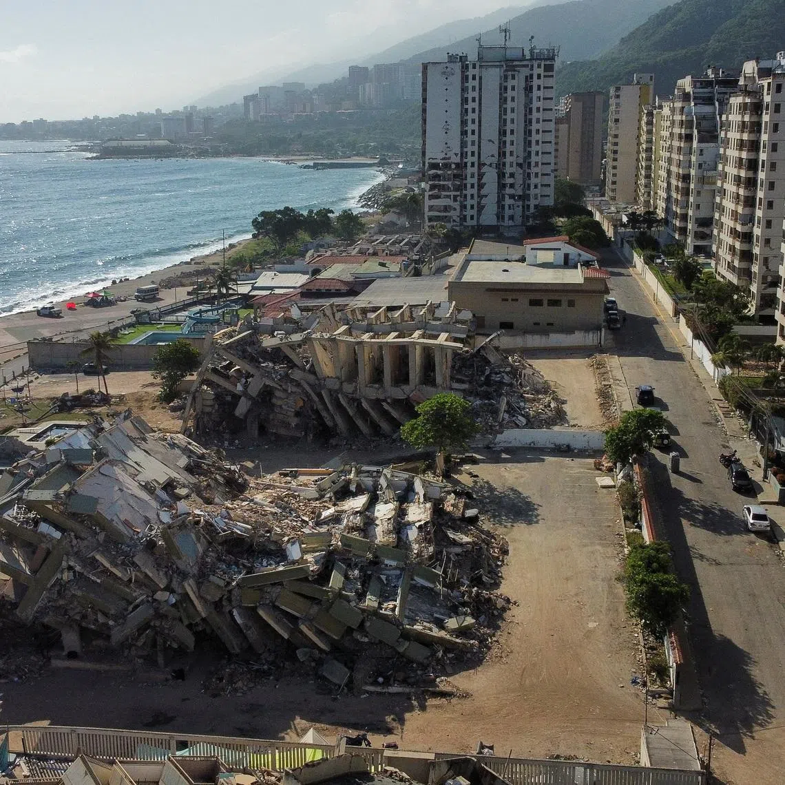 A drone view of the destroyed buildings in the aftermath of the June 24 earthquakes, in Macuto, La Guaira state, Venezuela July 8, 2026. REUTERS/Leonardo Fernandez Viloria