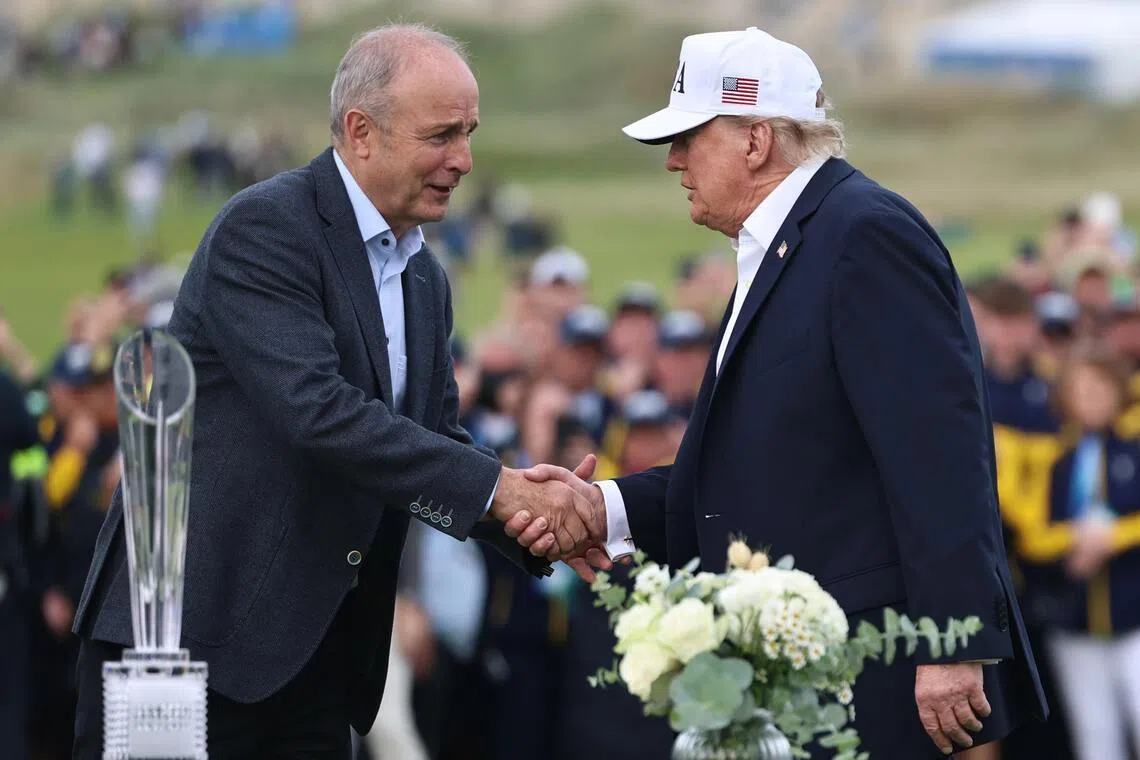 US President Donald Trump and Irish Prime Minister Micheal Martin (left) attending the trophy presentation of the Irish Open at the Trump International Golf Links and Hotel on Sept 13.