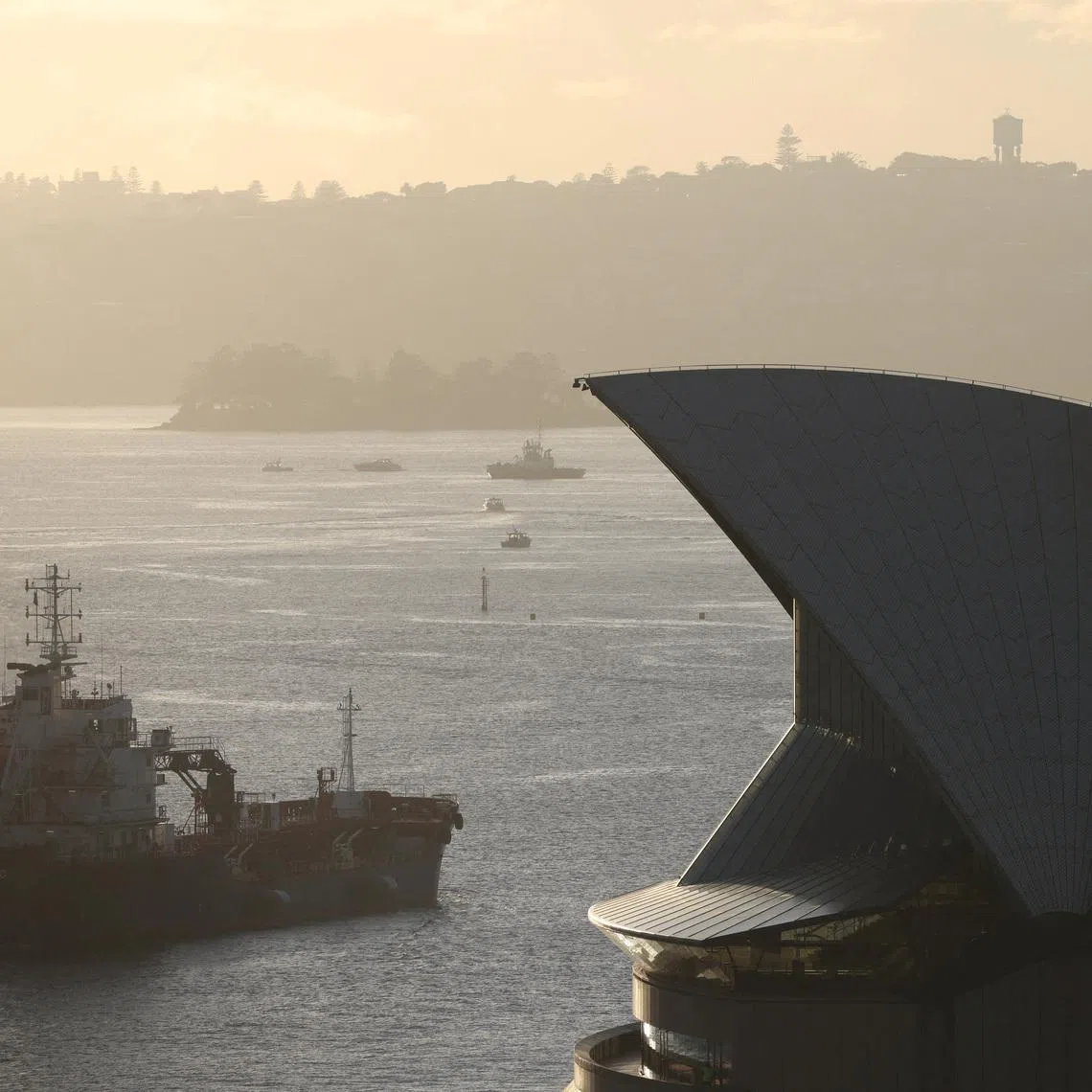 FILE PHOTO: An oil products tanker passes the Sydney Opera House at sunrise in Sydney, Australia, March 21, 2026. REUTERS/Hollie Adams/File Photo