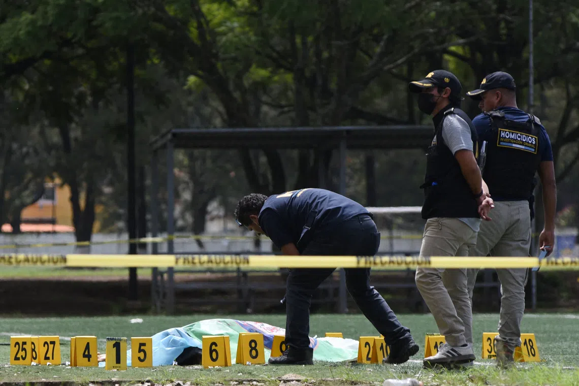 Authorities work at crime scene where Guatemalan lawyer Juan Francisco Solorzano Foppa was killed in an armed attack, on Oct 17.