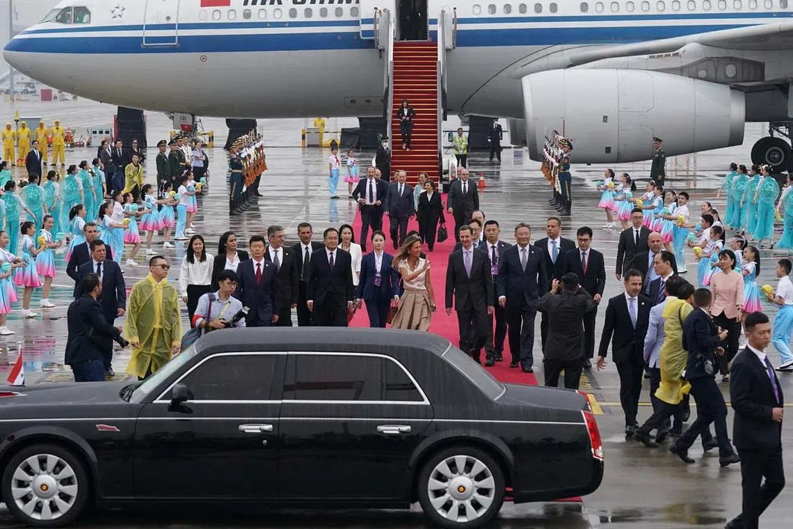 Syria's President Bashar al-Assad and his wife Asma are welcomed upon their arrival at Hangzhou airport, China, Sept 21.
