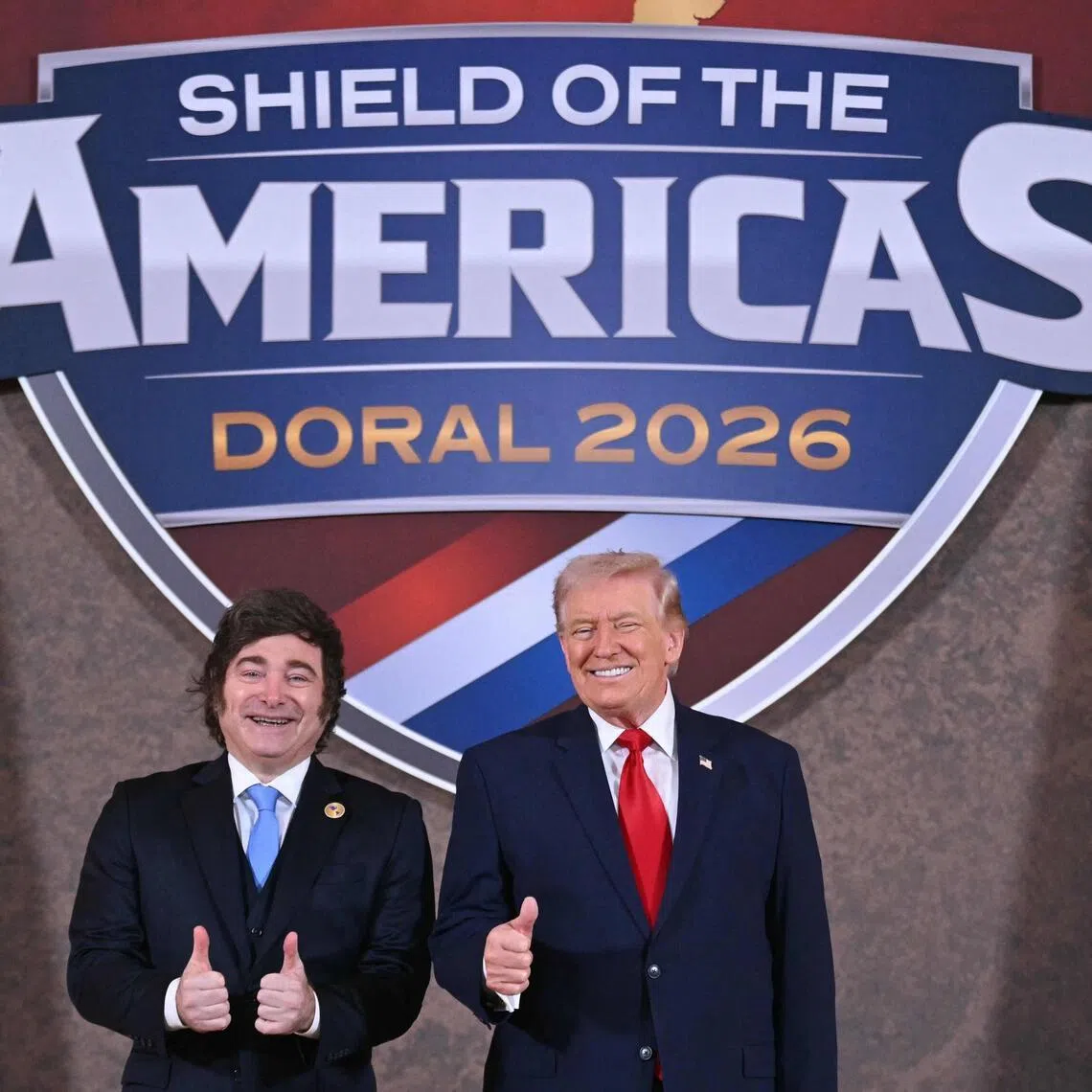 US President Donald Trump (right) welcoming Argentinian President Javier Milei to the "Shield of the Americas" summit on March 7, at Trump National Doral, in Miami, Florida.