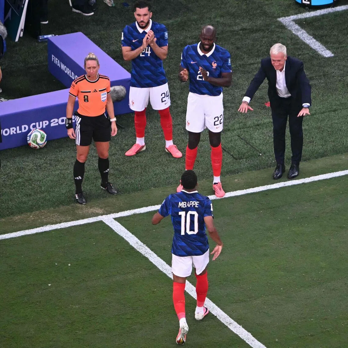 France manager Didier Deschamps bowing to forward Kylian Mbappe after subbing him out in their World Cup last-32 win over Sweden on June 30.