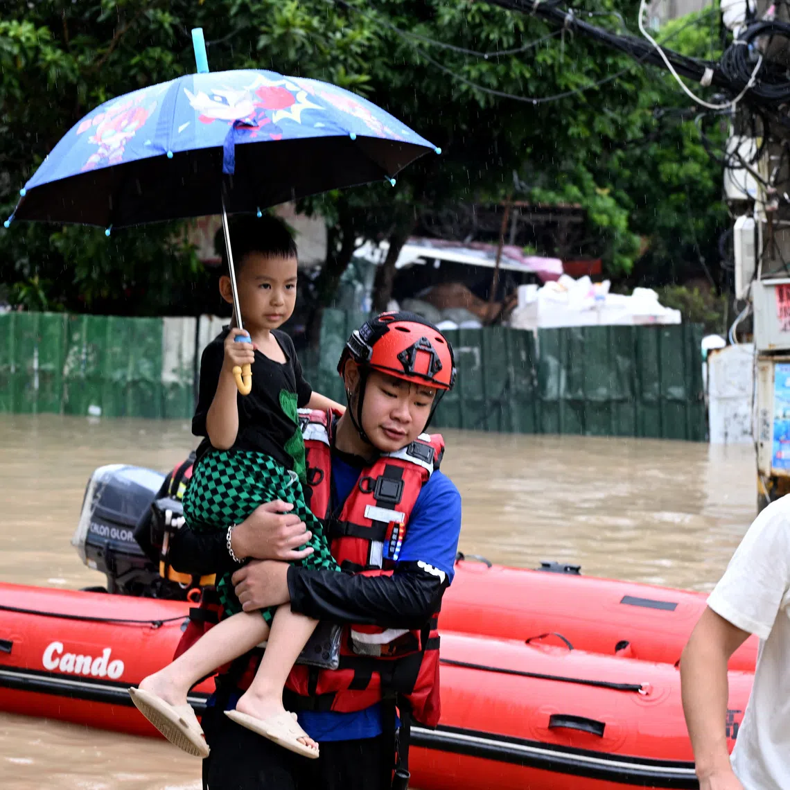 Residents are being rescued by boat amid flooding caused by heavy rainfall from Typhoon Saudel in Fuzhou, China, on Sept 3.