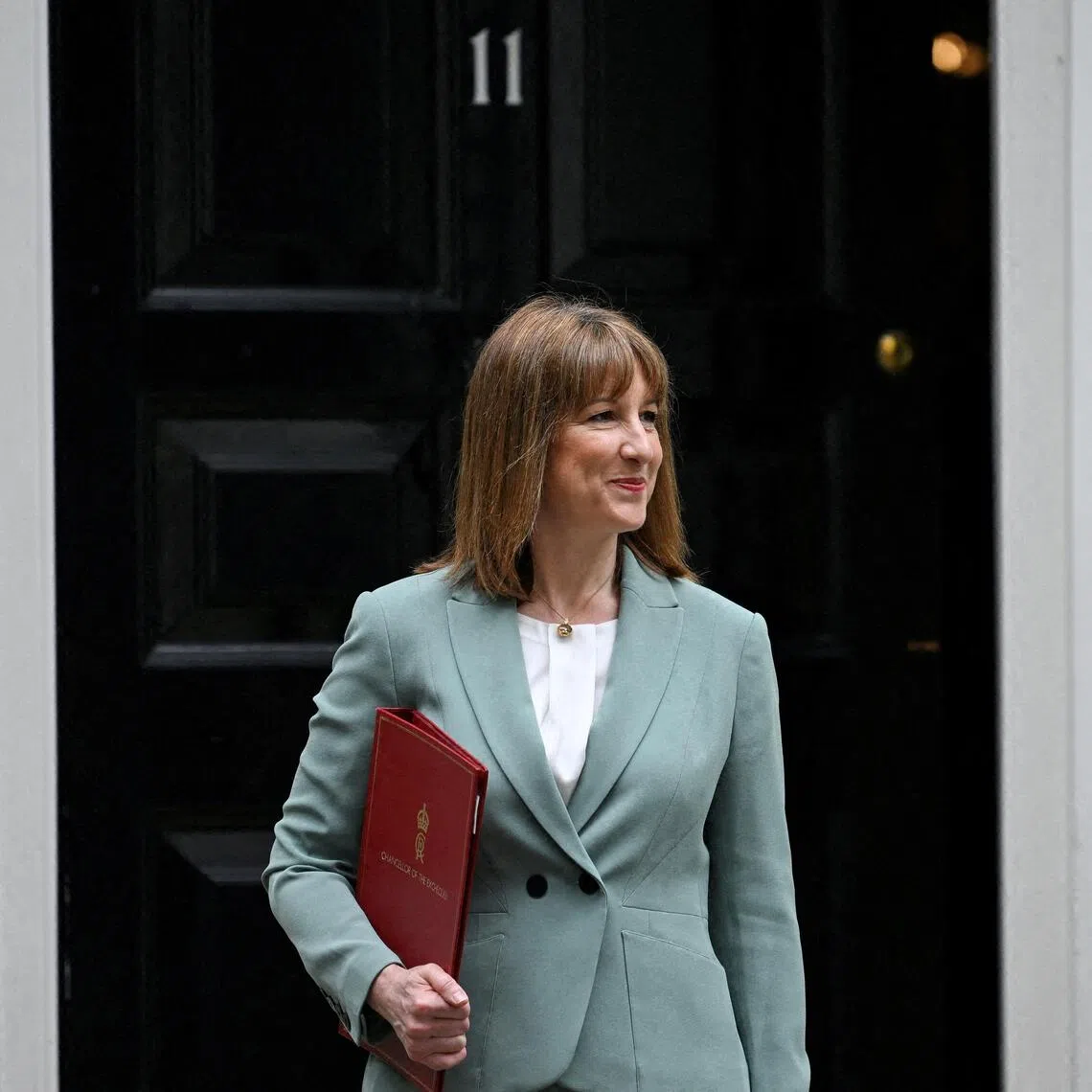 FILE PHOTO: FILE PHOTO: Britain's Chancellor of the Exchequer Rachel Reeves leaves 11 Downing Street, ahead of presenting the Spending Review to Parliament, in London, Britain, June 11, 2025. REUTERS/Jaimi Joy/File Photo/File Photo