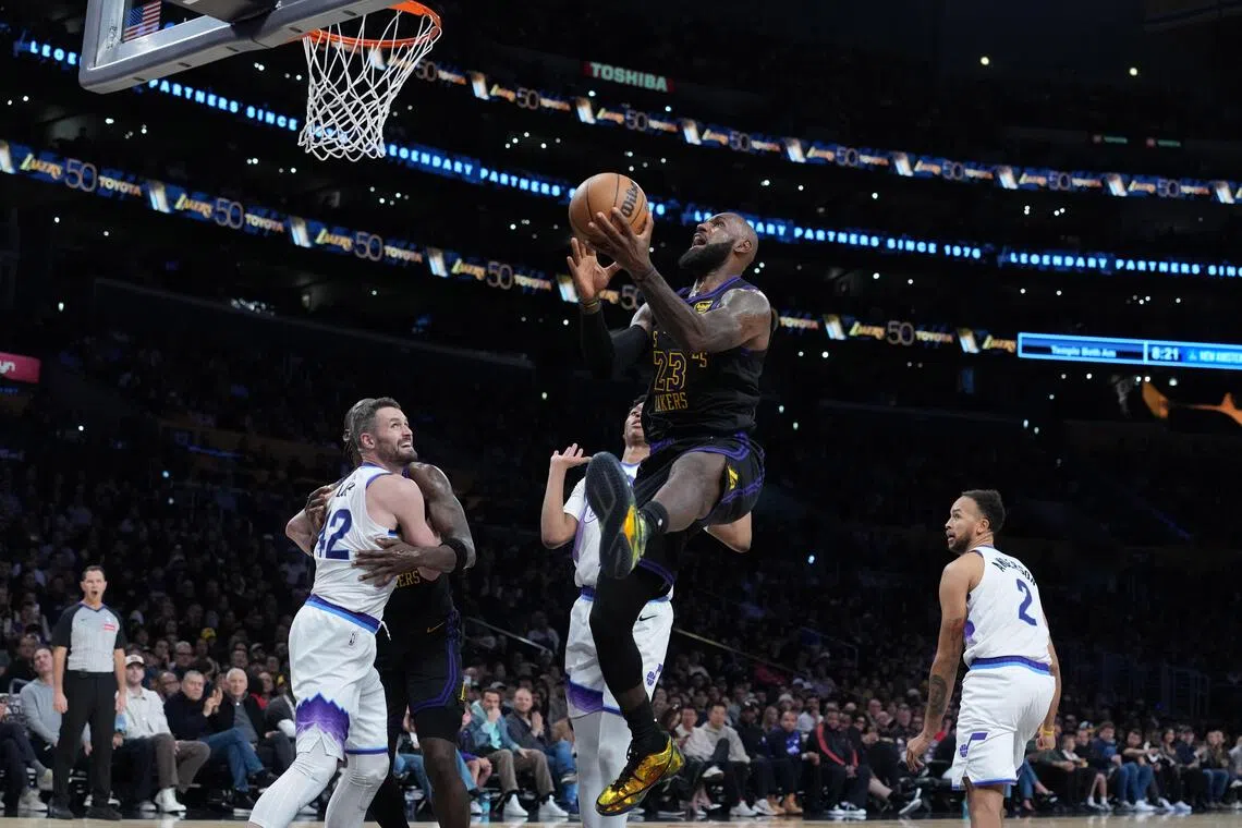 Los Angeles Lakers forward LeBron James driving to the basket against Utah Jazz forward Kevin Love (No. 42), guard Ace Bailey (No. 19) and forward Kyle Anderson (No. 2)  in the second quarter of the Lakers’ 140-126 NBA win at Crypto.com Arena on Nov 18, 2025.