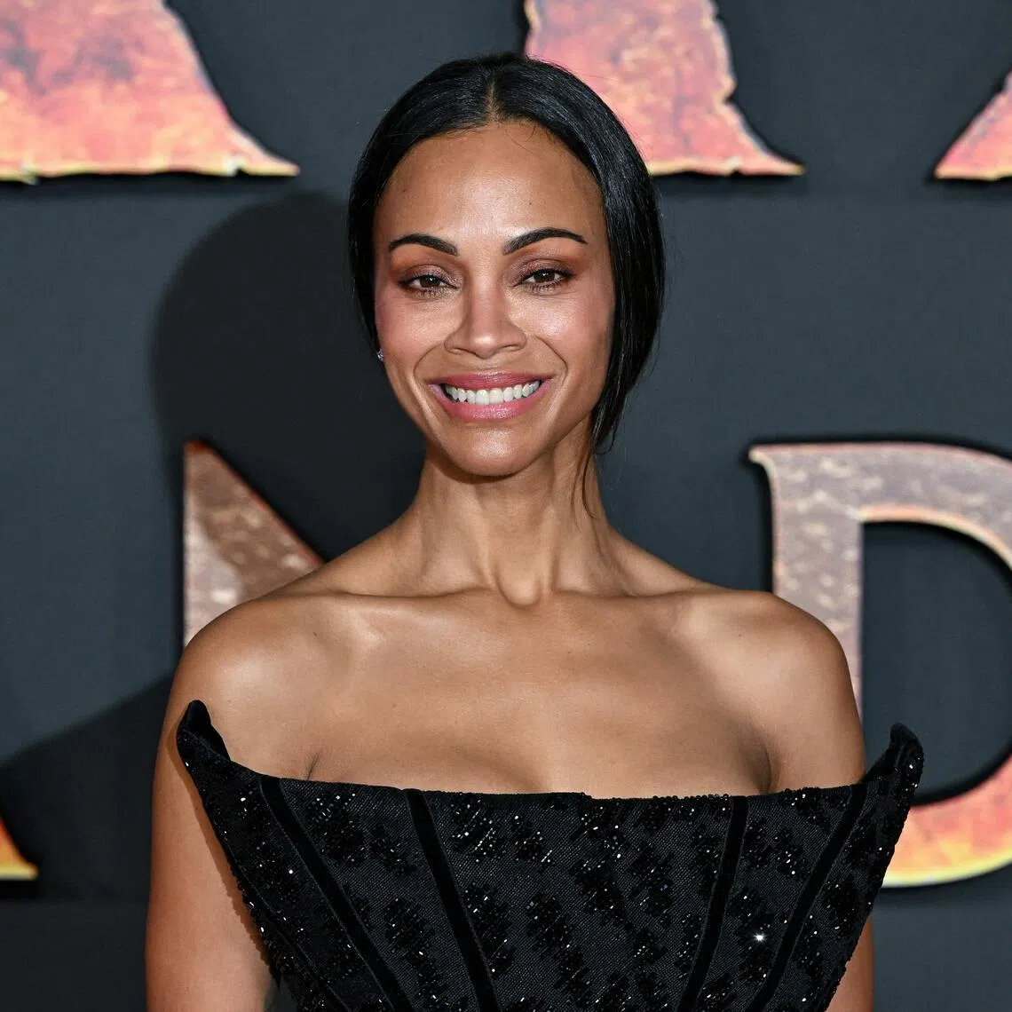 US actress Zoe Saldana poses during a photocall for the European premiere of "Avatar: Fire and Ash" at the Seine Musicale concert hall in Boulogne-Billancourt, on the outskirts of Paris on December 5, 2025. (Photo by Bertrand GUAY / AFP)