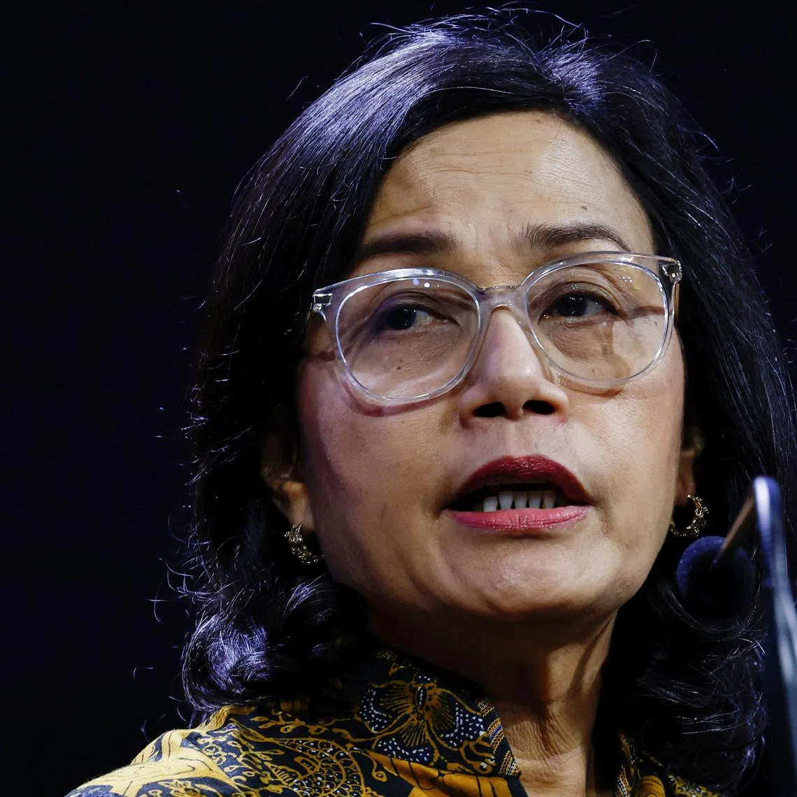 FILE PHOTO: Indonesia's Finance Minister Sri Mulyani Indrawati delivers her speech during the Mandiri Investment Forum in Jakarta, Indonesia, February 11, 2025. REUTERS/Willy Kurniawan
