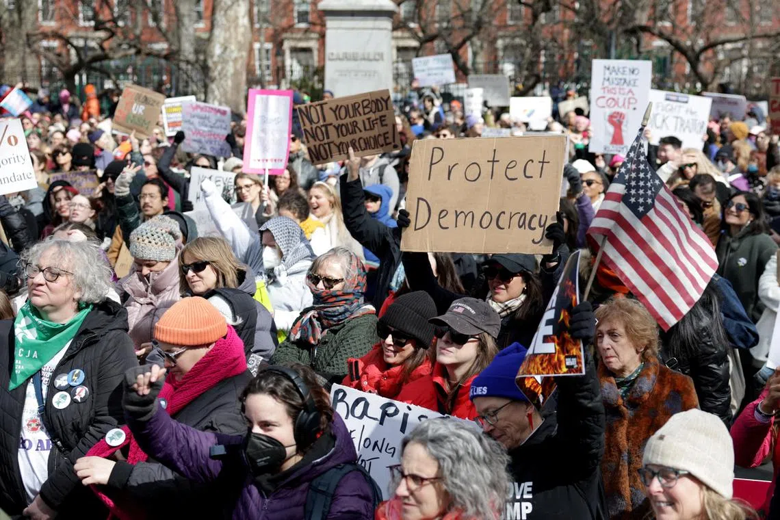People attend an International Women's Day march and rally in Manhattan in New York City on March 8. 