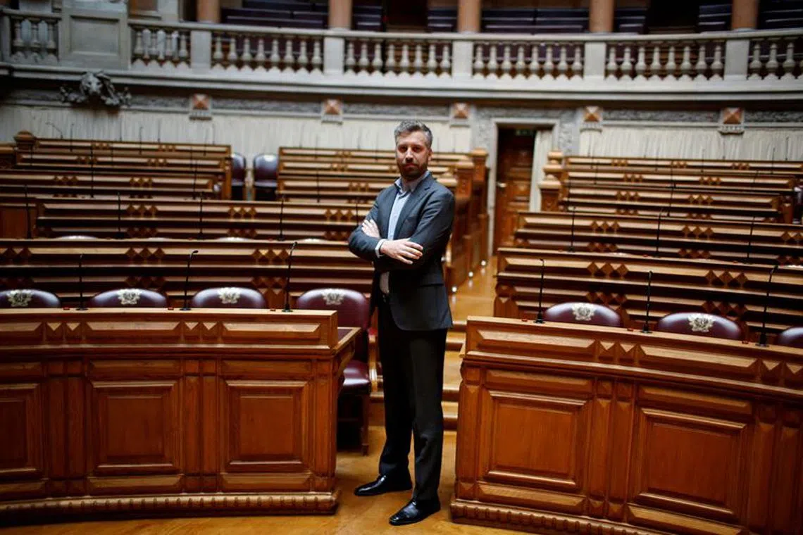 FILE PHOTO: Pedro Nuno Santos poses for a portrait between the legislators of Socialist party and left bloc inside Portuguese parliament in Lisbon, Portugal June 21, 2016. REUTERS/Rafael Marchante/File Photo