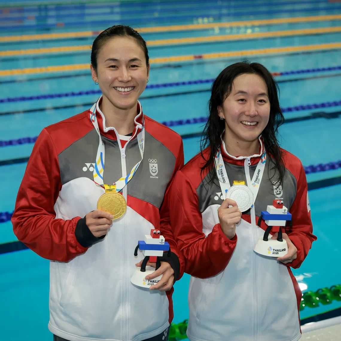 Quah Ting Wen (left) and Quah Jing Wen at the Sports Authority of Thailand Swimming Pool during the SEA Games in Bangkok on Dec 13.