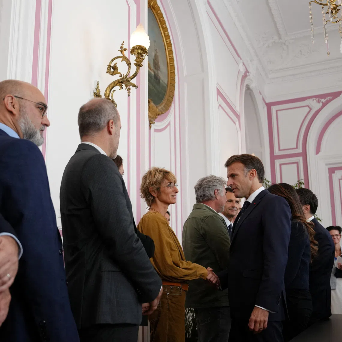 French President Emmanuel Macron meets with business owners whose businesses were damaged during recent riots in Marseille, France, October 26, 2026. Aurelien Morissard/Pool via REUTERS