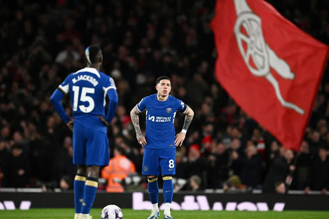 FILE PHOTO: Soccer Football - Premier League - Arsenal v Chelsea - Emirates Stadium, London, Britain - April 23, 2024 Chelsea's Enzo Fernandez and Nicolas Jackson look dejected after Arsenal's Kai Havertz scores their third goal REUTERS/Dylan Martinez/File Photo
