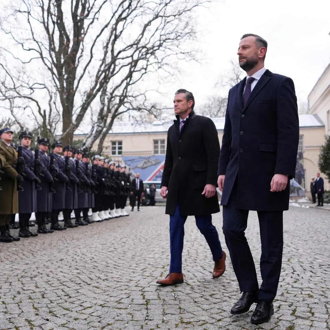 US Defence Secretary Pete Hegseth (centre) and Poland's Deputy Prime Minister and Defence Minister Wladyslaw Kosiniak-Kamysz (right) review an honorary guard as they meet in Warsaw, Poland, in Feb 14.