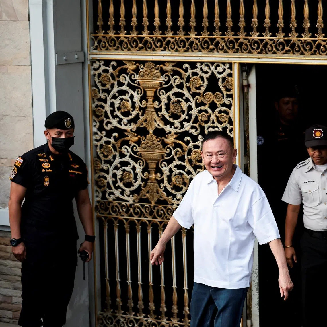 Former Thai Prime Minister Thaksin Shinawatra reacts following his release on parole after serving eight months of his one-year sentence at Klong Prem Central Prison, in Bangkok, Thailand, May 11, 2026. REUTERS/Chalinee Thirasupa