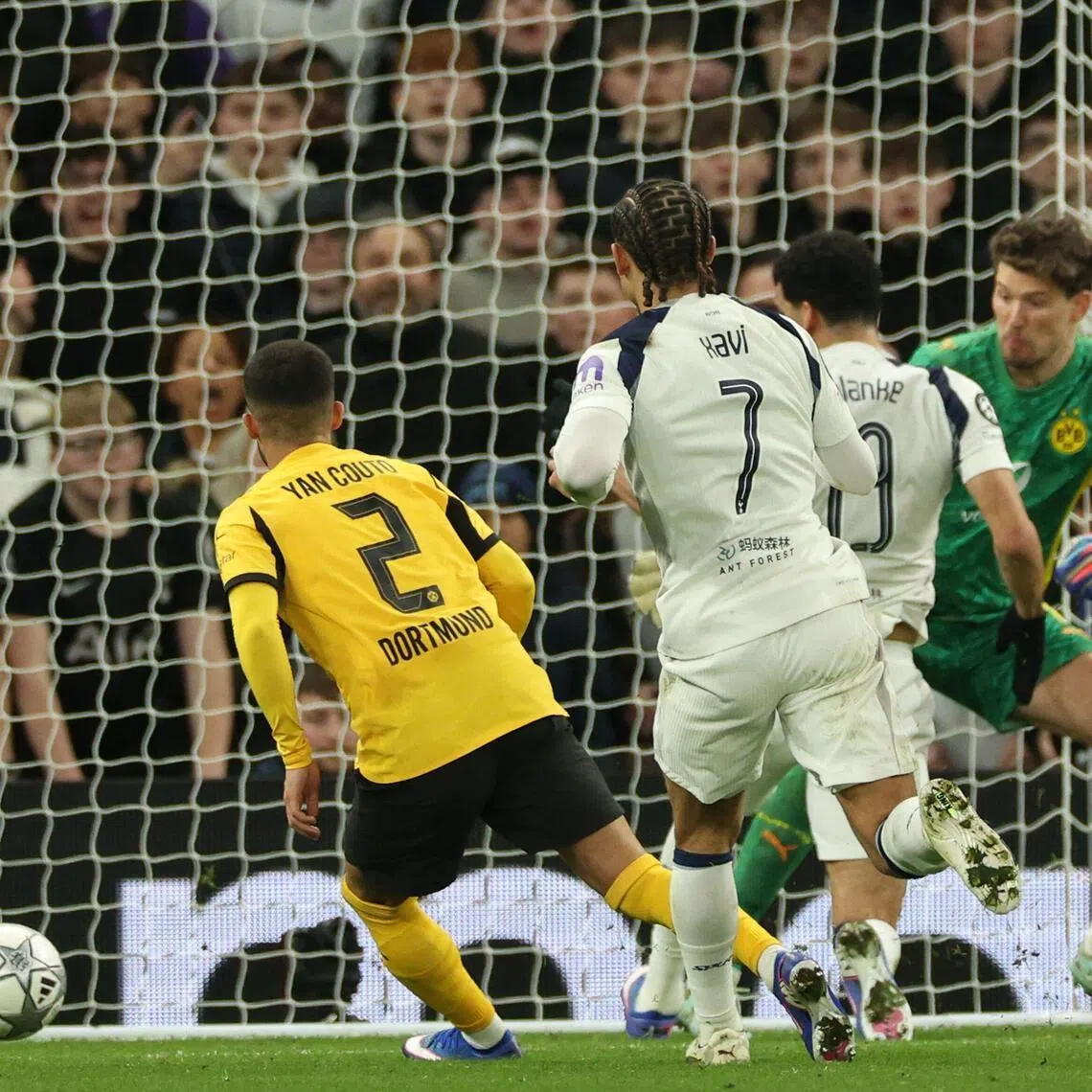 Tottenham Hotspur's Dominic Solanke (second from right) scores their second goal  against Borussia Dortmund.