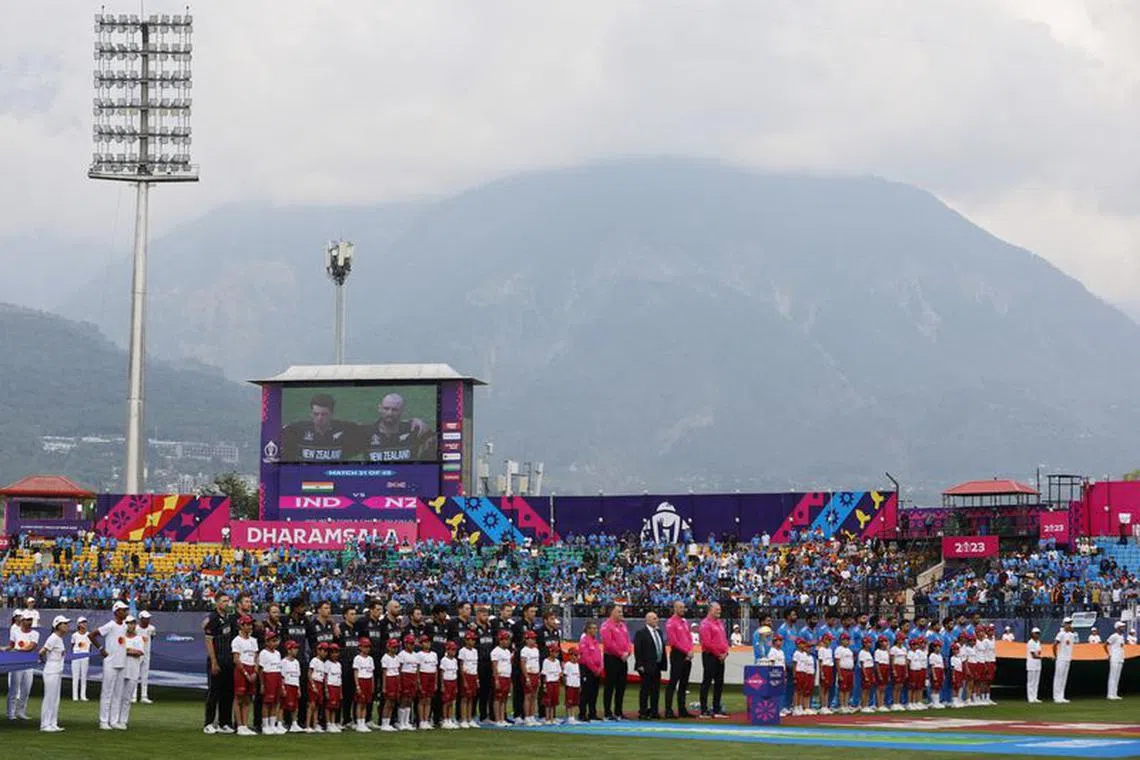 Cricket - ICC Cricket World Cup 2023 - India v New Zealand - Himachal Pradesh Cricket Association Stadium, Dharamsala, India - October 22, 2023  India and New Zealand players line up during the national anthems before the match REUTERS/Adnan Abidi