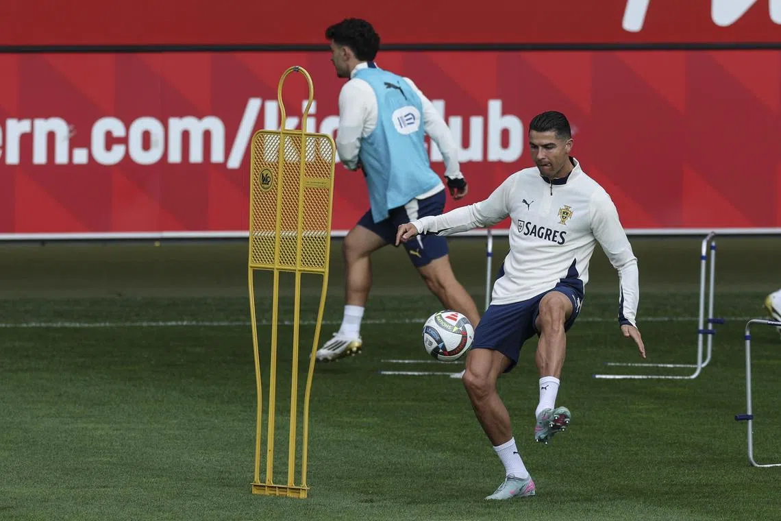Portugal's Cristiano Ronaldo (right) taking part in a June 6 training session in Munich, Germany.