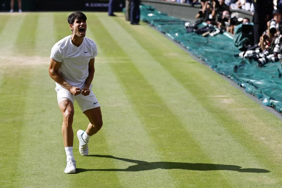 Carlos Alcaraz of Spain celebrates after winning the men's singles final against Novak Djokovic.