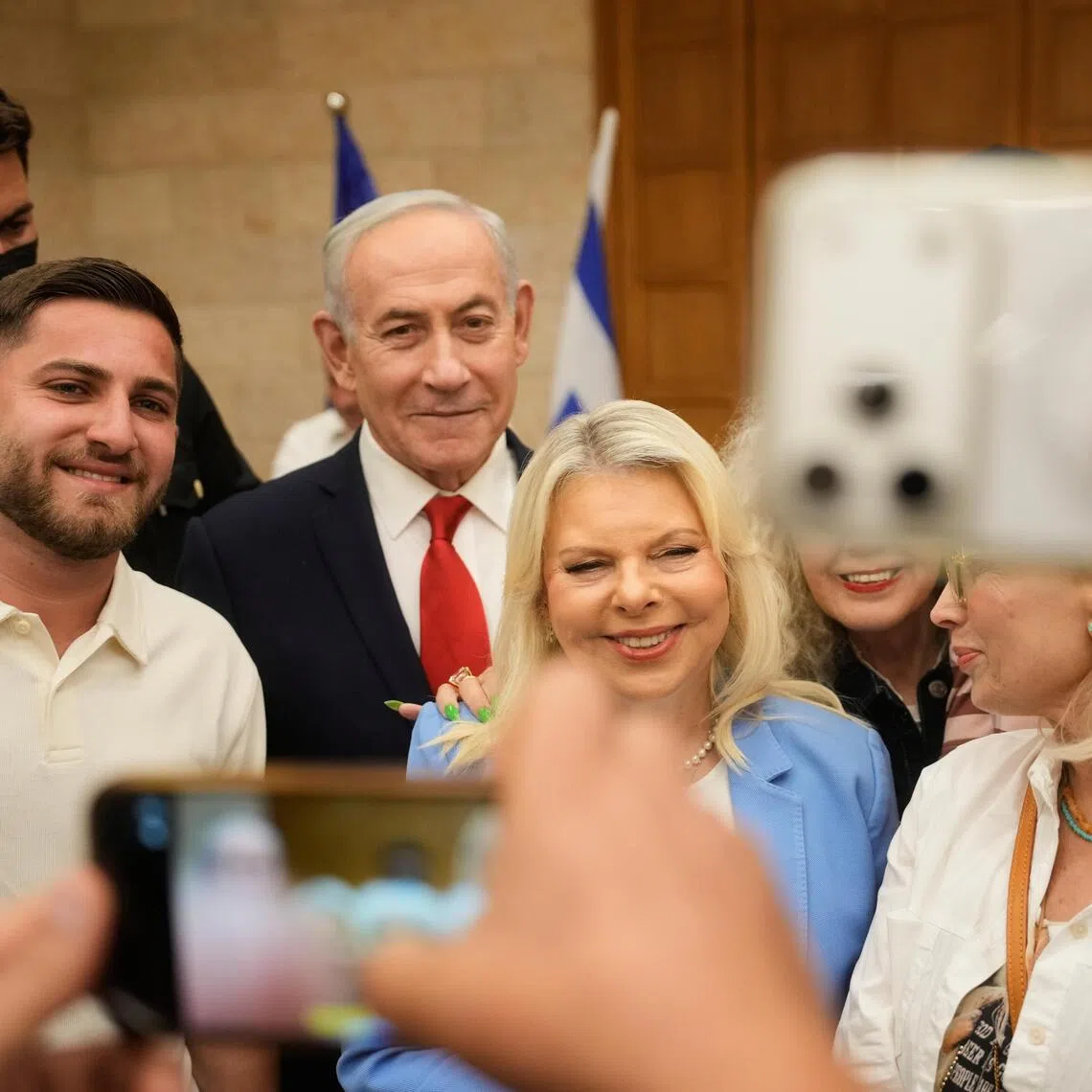 People taking a selfie with Israeli Prime Minister Benjamin Netanyahu and his wife, Sara Netanyahu, during the Likud party primary in Jerusalem, on Aug 17, ahead of Israel’s October general election.